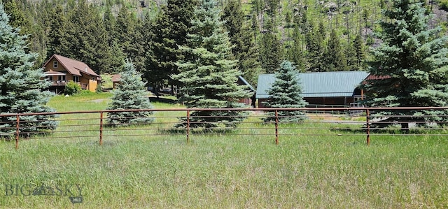 1105 S Boulder Rd, Cardwell, MT 59721 - view of yard featuring a wooded view