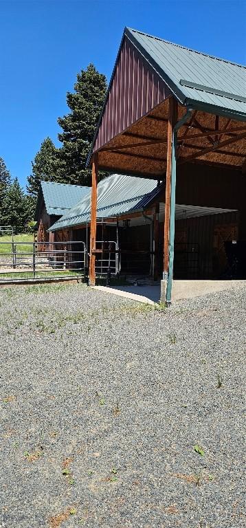 1105 S Boulder Rd, Cardwell, MT 59721 - view of car parking featuring an exterior structure and gravel driveway