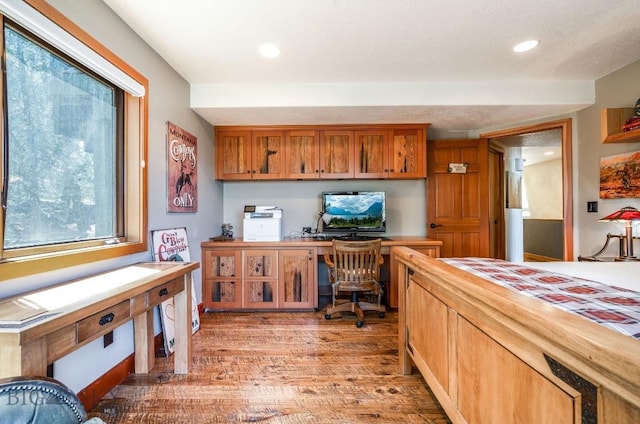 953 Angel Point Rd, Lakeside, MT 59922 - office featuring light wood finished floors, built in study area, and recessed lighting