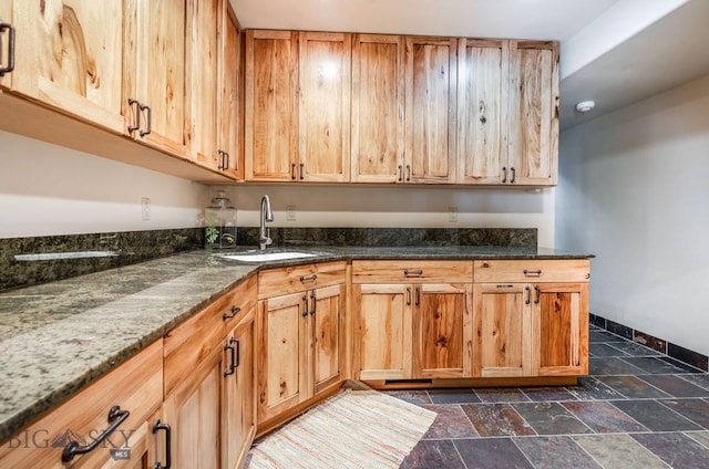 953 Angel Point Rd, Lakeside, MT 59922 - kitchen featuring stone tile flooring and dark stone counters