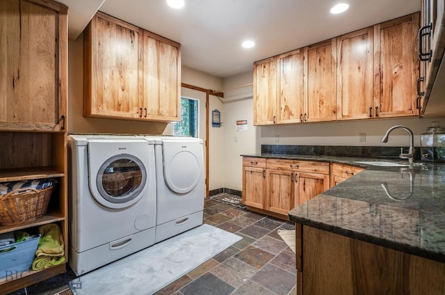 953 Angel Point Rd, Lakeside, MT 59922 - washroom featuring cabinet space, stone tile floors, washer and clothes dryer, and recessed lighting