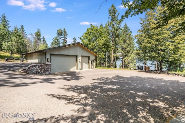 953 Angel Point Rd, Lakeside, MT 59922 - view of side of home featuring an outbuilding and a garage
