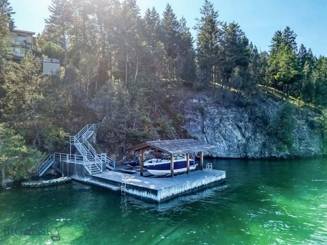 953 Angel Point Rd, Lakeside, MT 59922 - dock area with stairs, a water view, and a wooded view