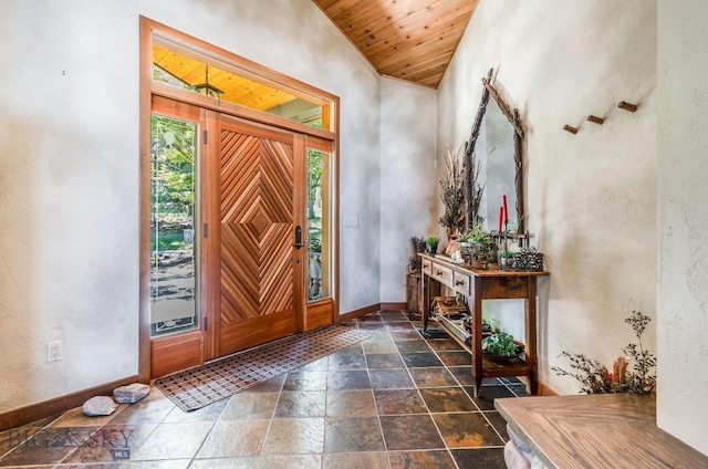 953 Angel Point Rd, Lakeside, MT 59922 - foyer entrance featuring stone tile floors, wooden ceiling, and lofted ceiling