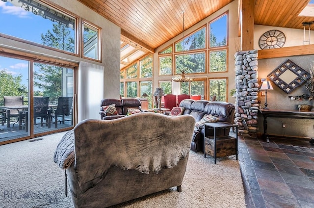 953 Angel Point Rd, Lakeside, MT 59922 - living room featuring high vaulted ceiling, wooden ceiling, plenty of natural light, stone tile floors, and a chandelier