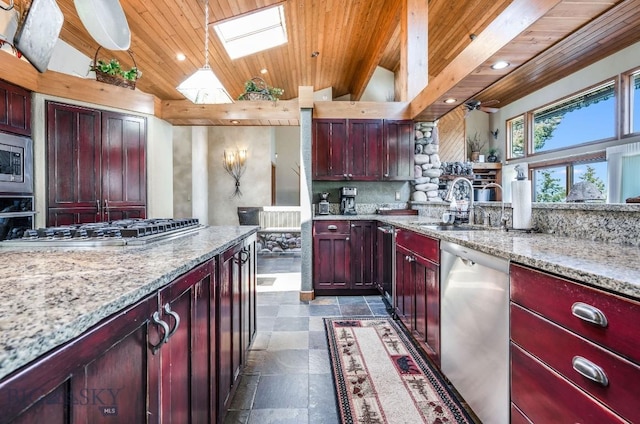 953 Angel Point Rd, Lakeside, MT 59922 - kitchen with stainless steel appliances, dark brown cabinets, lofted ceiling, wooden ceiling, and light stone countertops