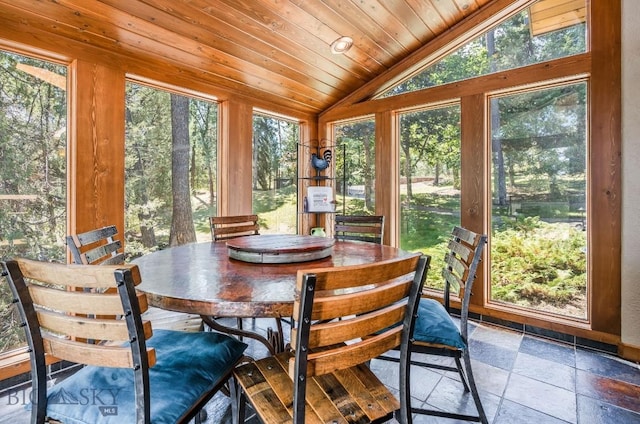 953 Angel Point Rd, Lakeside, MT 59922 - sunroom / solarium featuring vaulted ceiling, stone tile floors, and wood ceiling