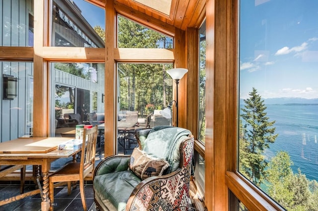 953 Angel Point Rd, Lakeside, MT 59922 - sunroom / solarium with a water view, plenty of natural light, and tile patterned floors