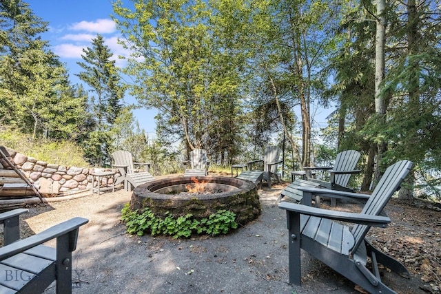 953 Angel Point Rd, Lakeside, MT 59922 - view of patio featuring a fire pit