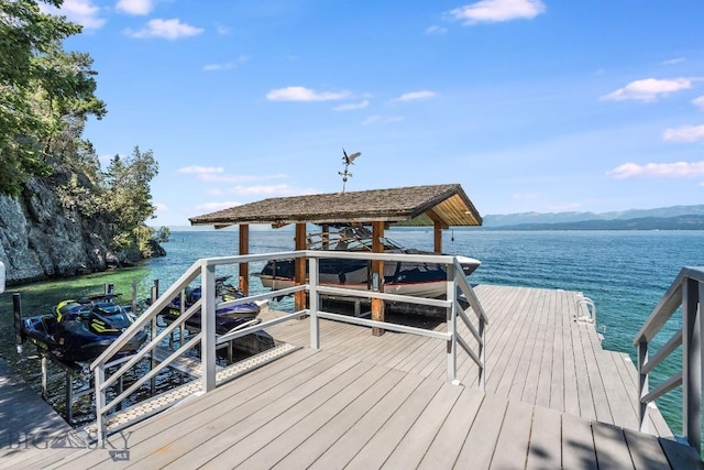 953 Angel Point Rd, Lakeside, MT 59922 - dock featuring a water and mountain view