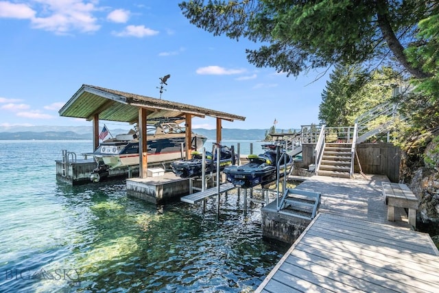 953 Angel Point Rd, Lakeside, MT 59922 - dock featuring boat lift, a water view, and stairs