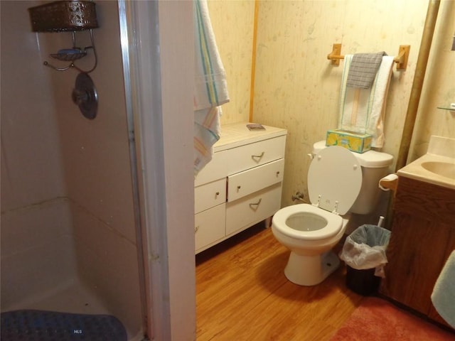 120 Balsam St, Anaconda, MT 59711 - bathroom with vanity, wood finished floors, a stall shower, and wallpapered walls