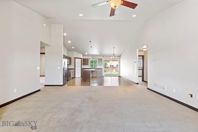 343 Stewart Loop, Bozeman, MT 59718 - unfurnished living room with a ceiling fan, recessed lighting, light colored carpet, and high vaulted ceiling