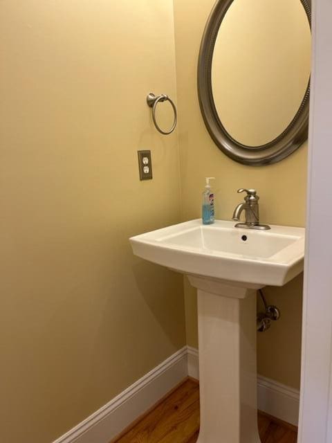 bathroom with sink and hardwood / wood-style floors