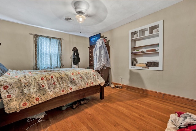 bedroom featuring ceiling fan and wood-type flooring