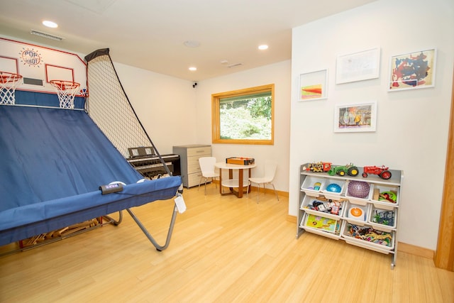 recreation room featuring light hardwood / wood-style floors