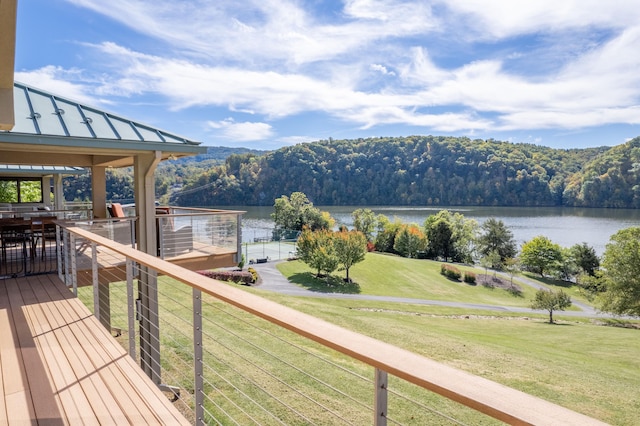 deck featuring a lawn, a water view, and a gazebo