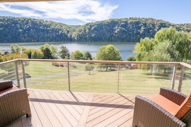 wooden terrace with a water view