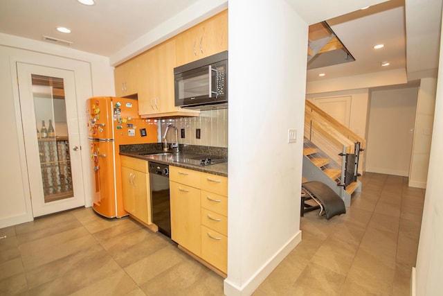 kitchen with light tile floors, tasteful backsplash, black appliances, and light brown cabinetry