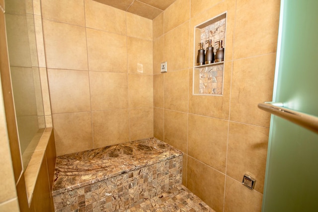 bathroom featuring tiled shower