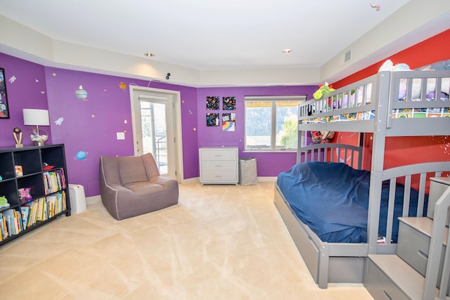 carpeted bedroom featuring multiple windows