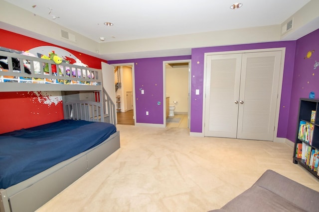 carpeted bedroom featuring a closet