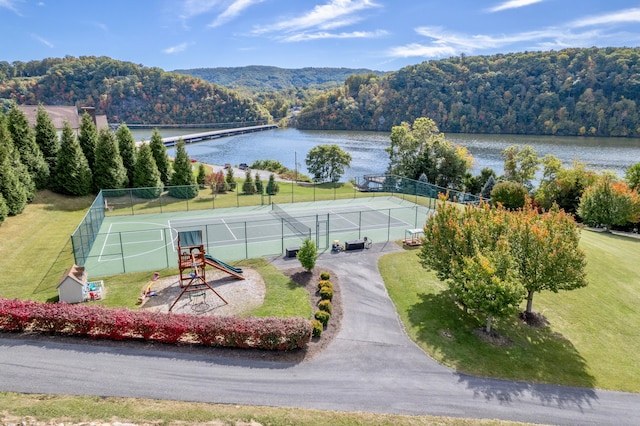 birds eye view of property with a water view