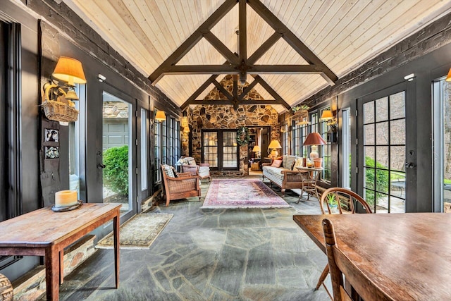 sunroom with french doors, vaulted ceiling with beams, and wooden ceiling