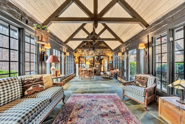 sunroom / solarium featuring wooden ceiling, vaulted ceiling with beams, and a wealth of natural light