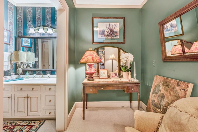 sitting room featuring sink, ornamental molding, and light carpet