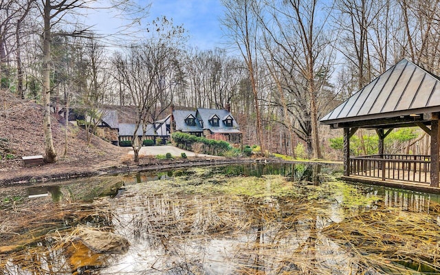 view of yard with a water view and a gazebo