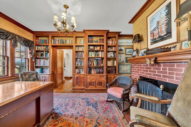 office area featuring a brick fireplace, a notable chandelier, and dark hardwood / wood-style floors