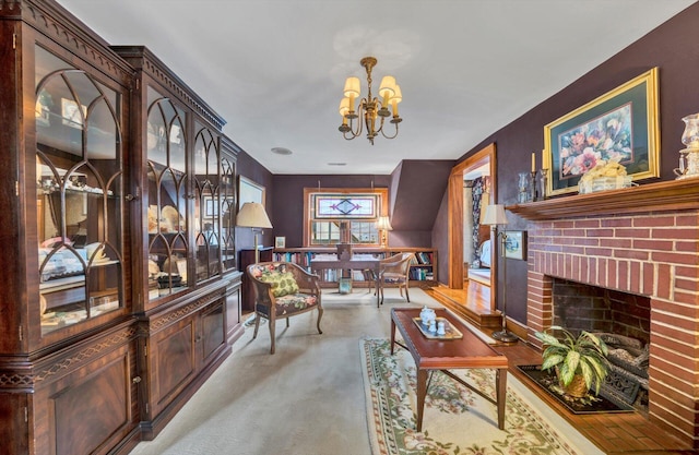 living room with an inviting chandelier and a fireplace