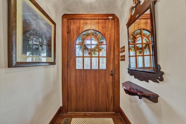 entryway featuring wood-type flooring