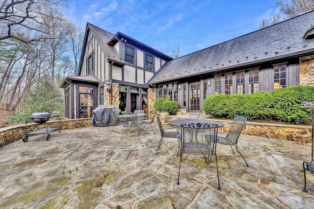 view of patio / terrace featuring french doors and a grill