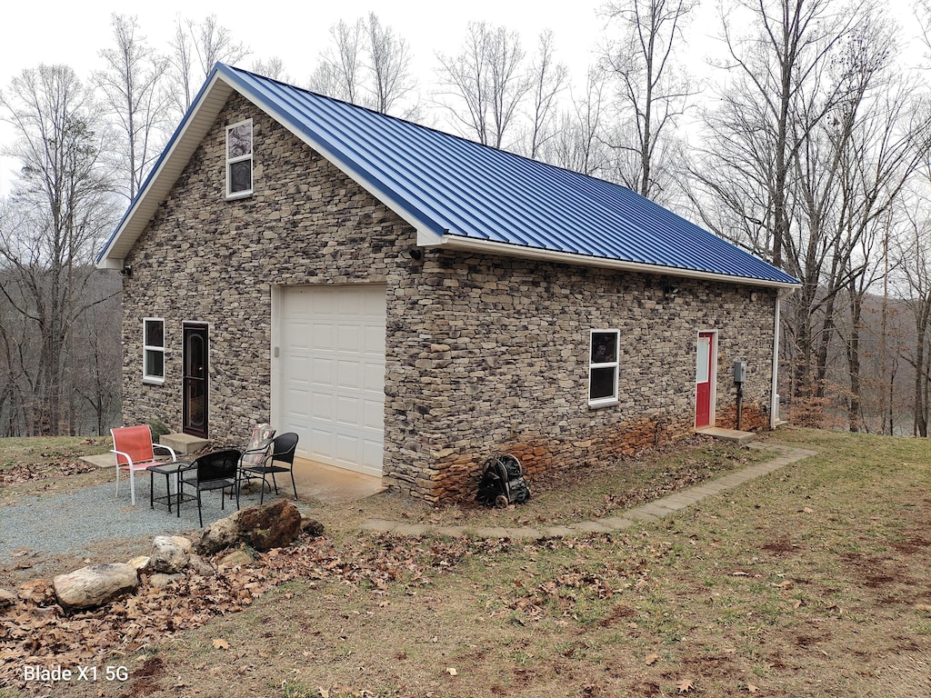 view of side of property with a garage