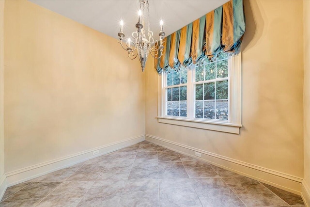 unfurnished room featuring light tile floors and an inviting chandelier