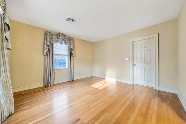 unfurnished room featuring light hardwood / wood-style floors