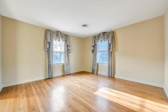 spare room with light wood-type flooring