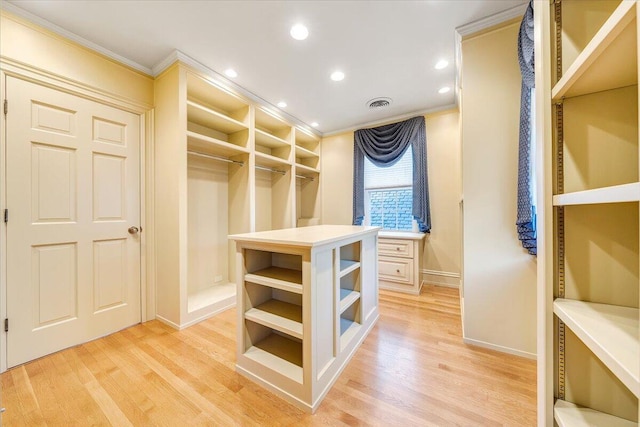 walk in closet featuring light hardwood / wood-style floors