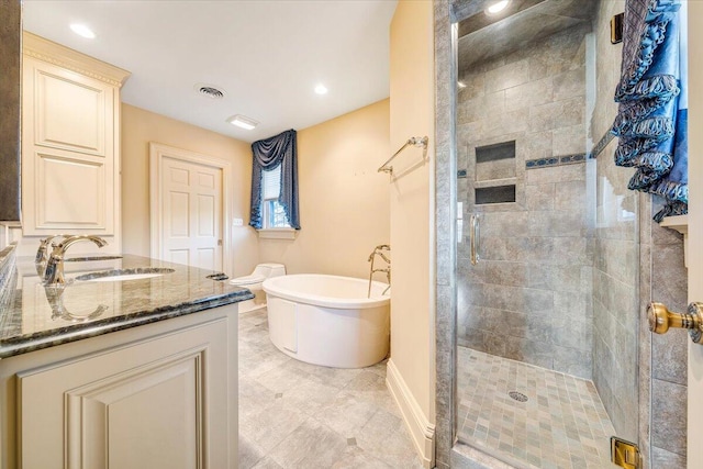 bathroom with vanity, tile floors, and independent shower and bath