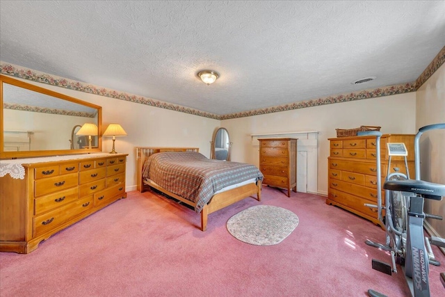 carpeted bedroom featuring a textured ceiling