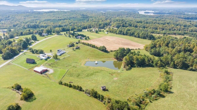 drone / aerial view featuring a water view and a rural view