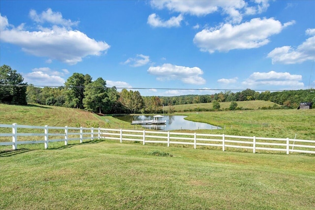 view of yard featuring a rural view and a water view