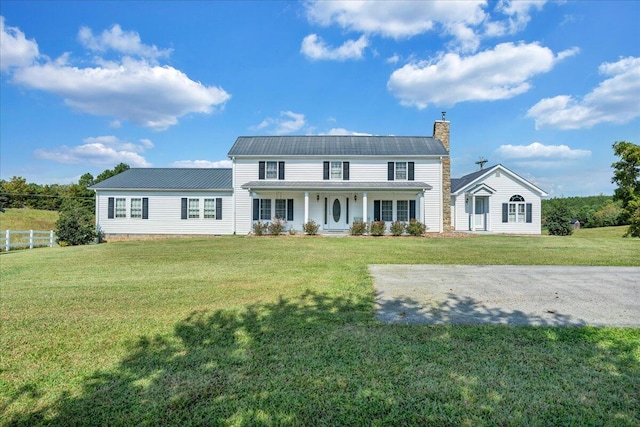 colonial-style house with a front lawn