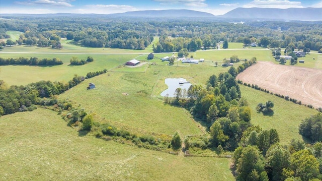 birds eye view of property featuring a mountain view and a rural view