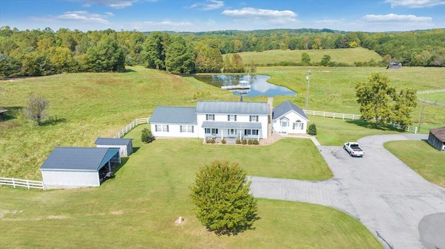 drone / aerial view with a water view and a rural view