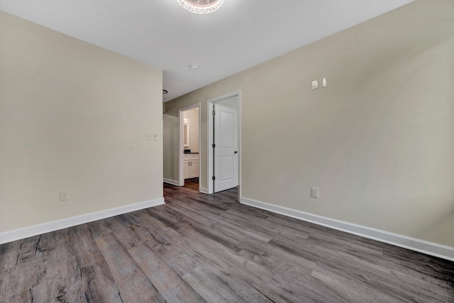 spare room with hardwood / wood-style flooring