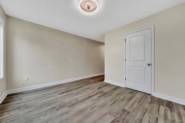 spare room featuring light hardwood / wood-style flooring