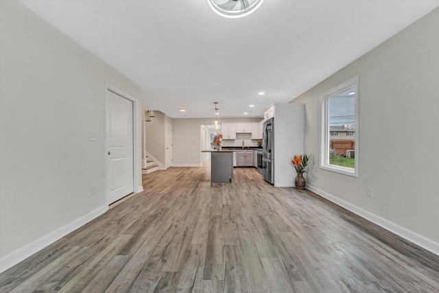 unfurnished living room featuring hardwood / wood-style floors